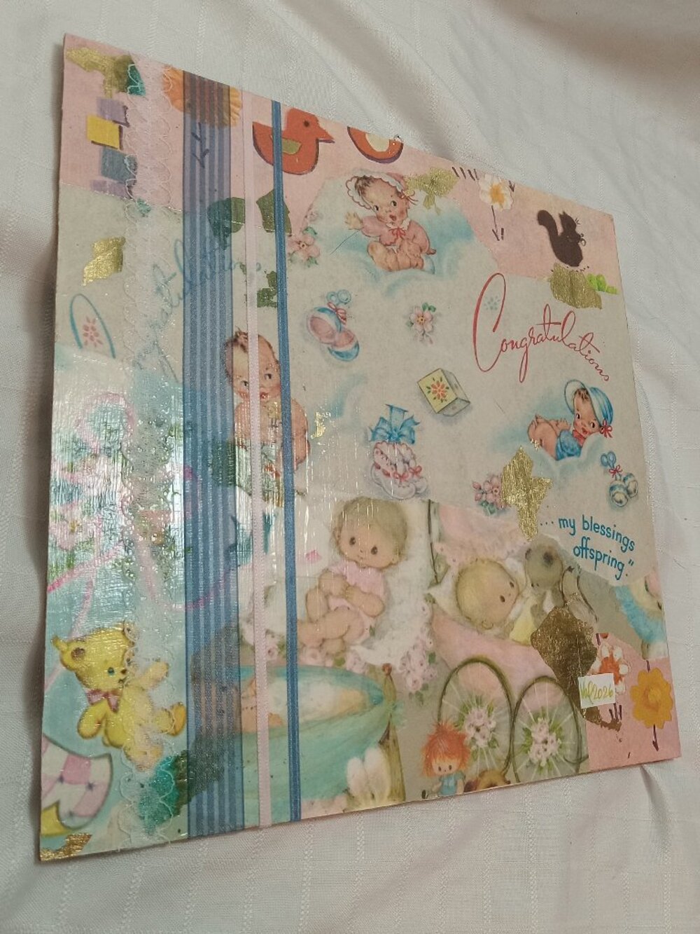 A delicate collage on strong cardboard for a baby's or play room